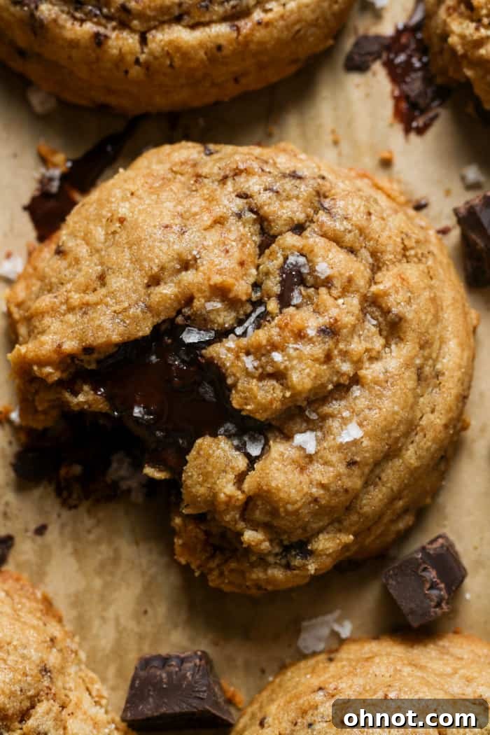 Stack of Paleo chocolate chunk cookies on a cooling rack.