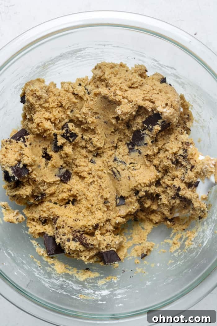 Paleo cookie dough with chocolate chunks folded in.