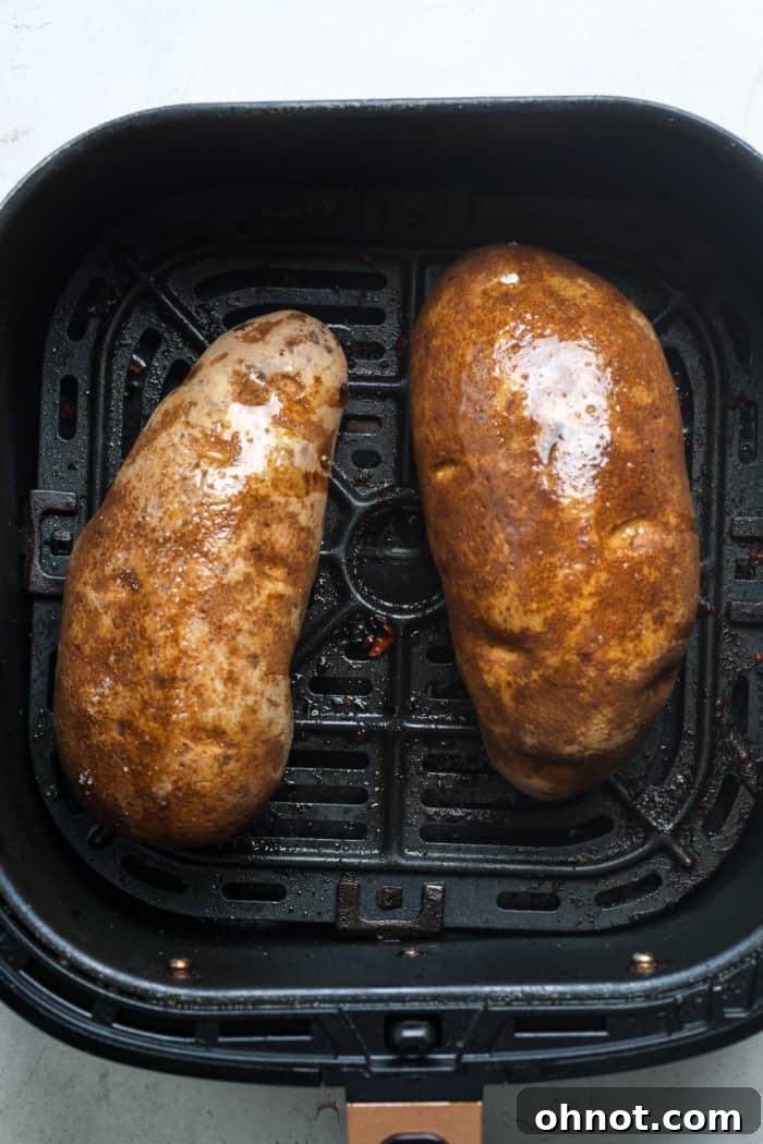 Potato in air fryer basket.