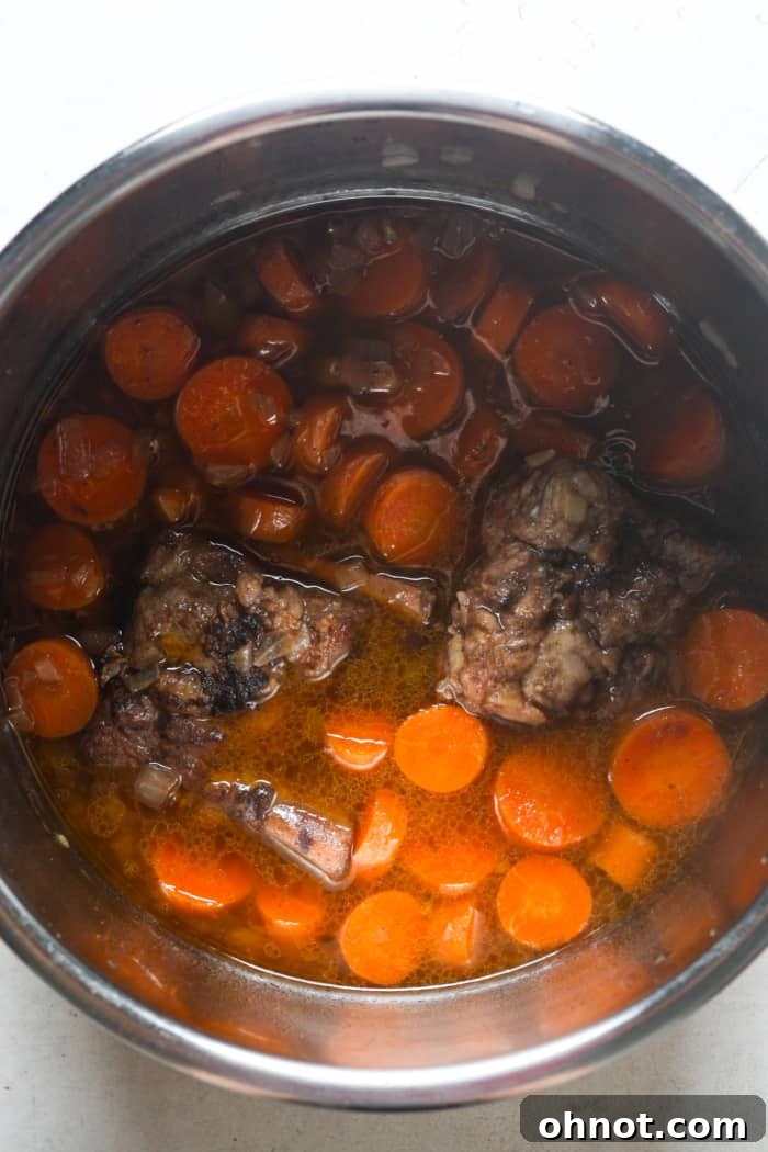 Tender meat and carrots in the Instant Pot after pressure release.