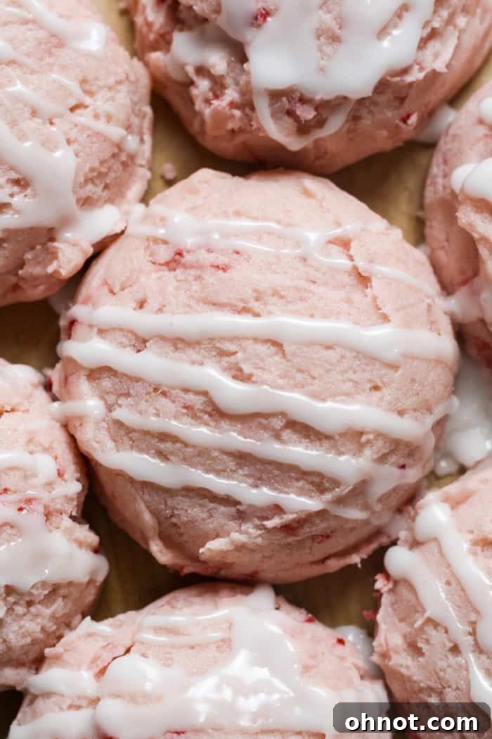 Stack of glazed strawberry cookies.