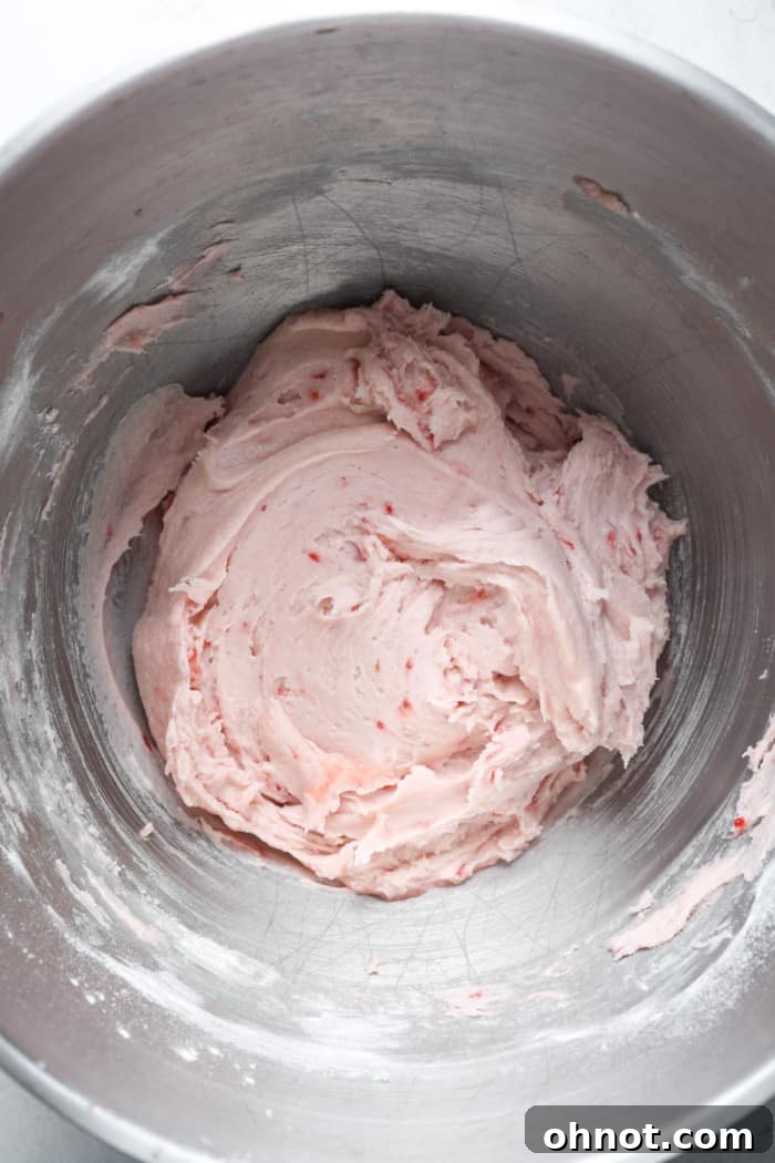 Strawberry cookie dough in a mixing bowl.