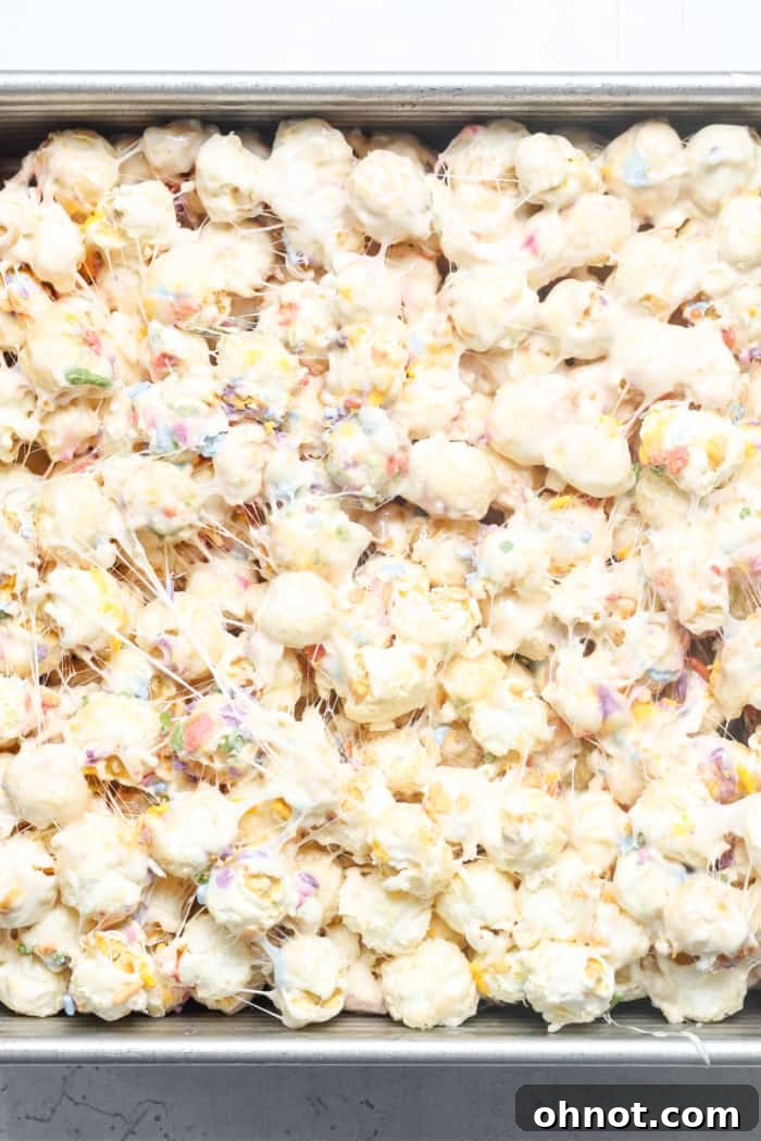 Popcorn bars evenly pressed into the pan, ready for final touches.