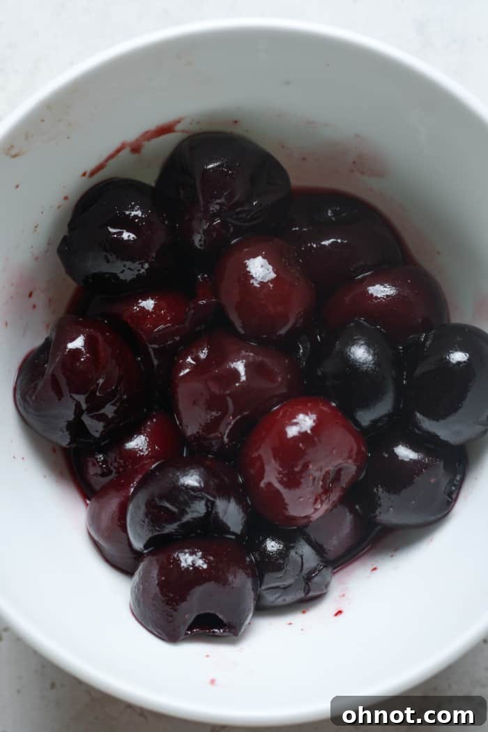 Juicy thawed cherries in a bowl.