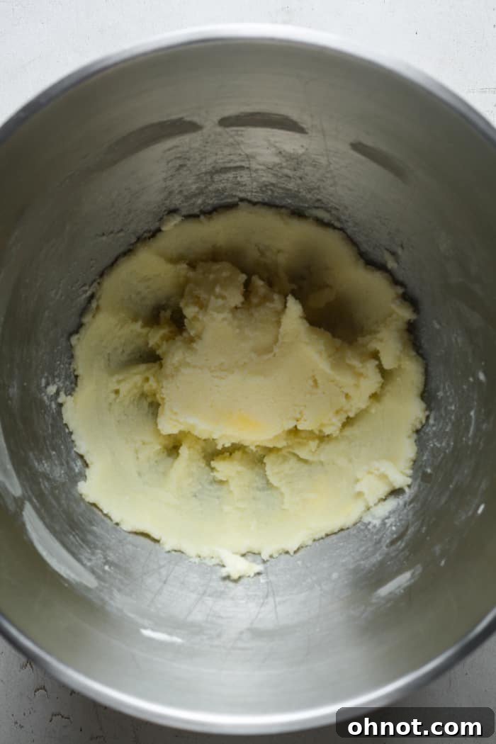 Creamy butter and sugar mixture in a stand mixer.