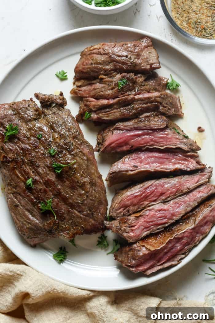 Perfectly seared skirt steak, ready to be sliced and served.