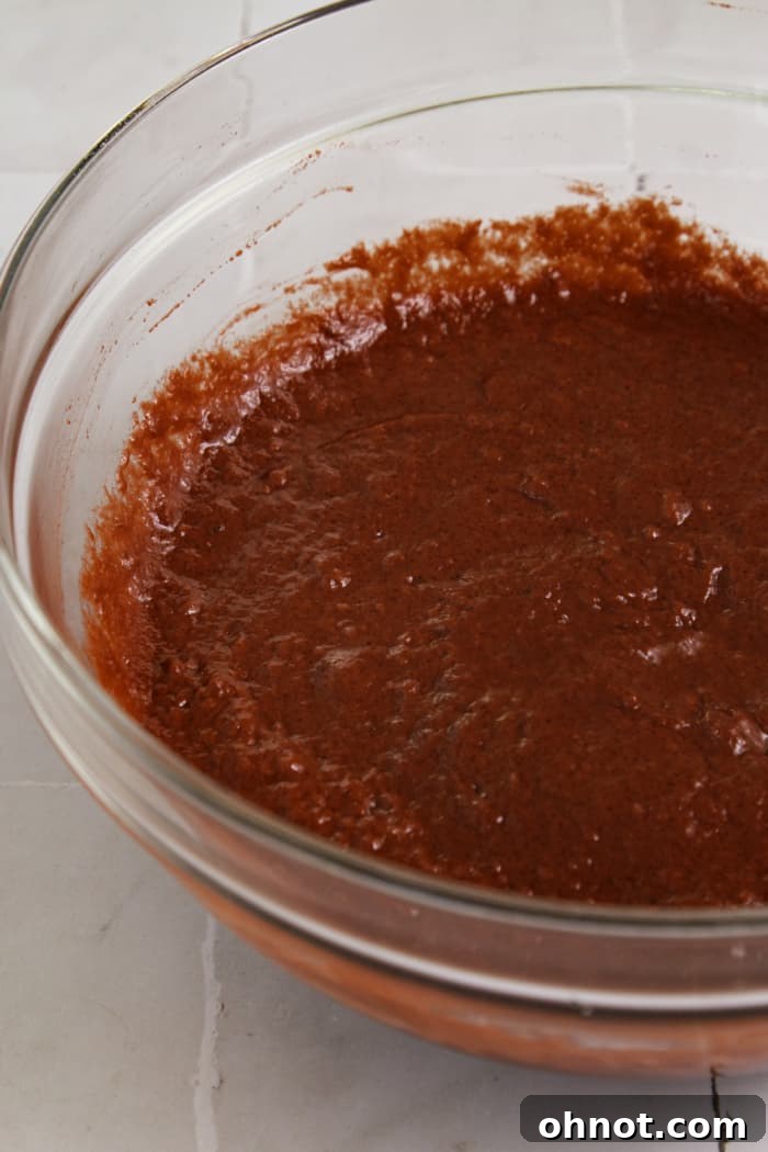 Red batter in bowl.