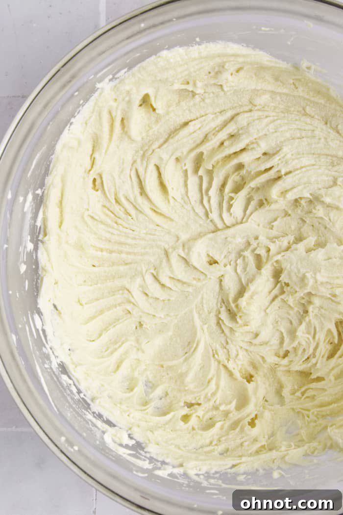 Cream cheese frosting in bowl.