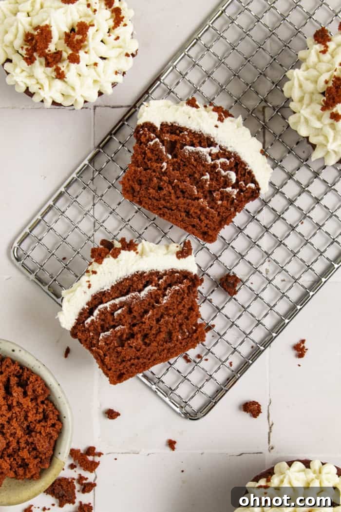 Sliced cupcake with frosting.