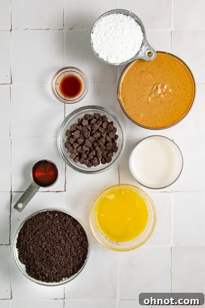 Assortment of ingredients for making chocolate peanut butter pie, including Oreos, peanut butter, chocolate chips, and milk.