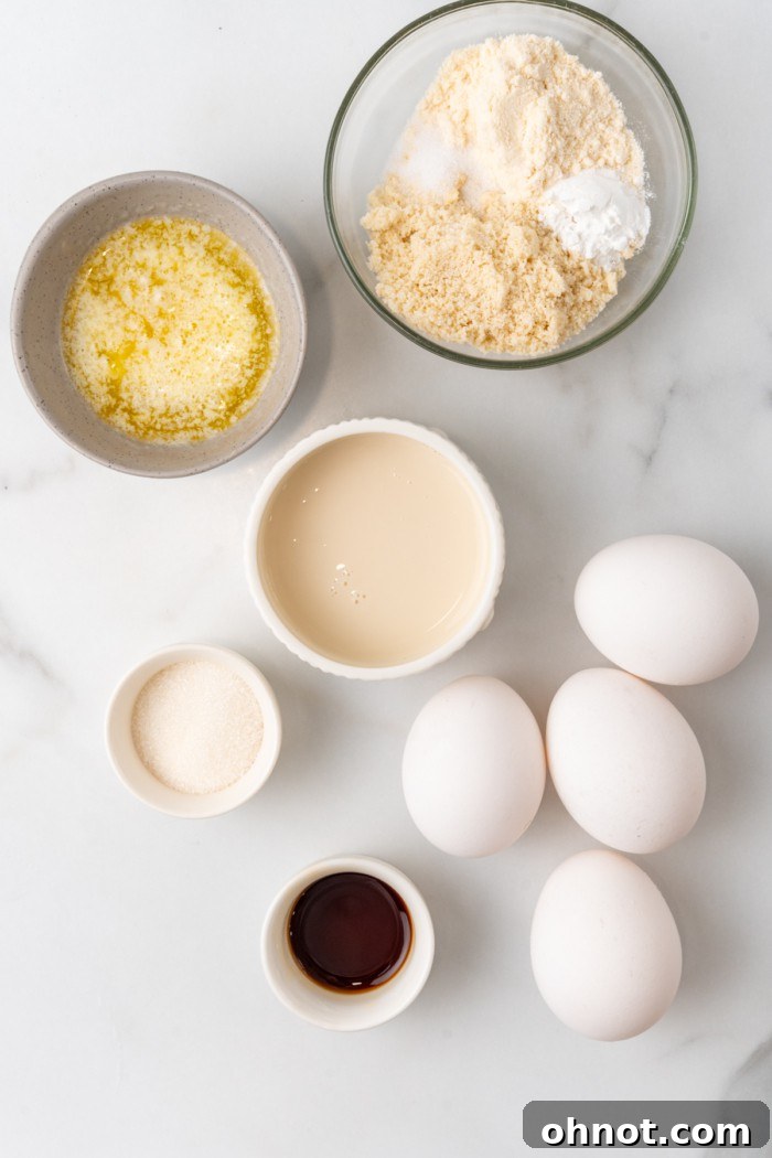 Ingredients laid out for making keto pancakes, including eggs, flours, and sweeteners.