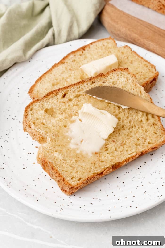 A slice of gluten-free bread with butter.