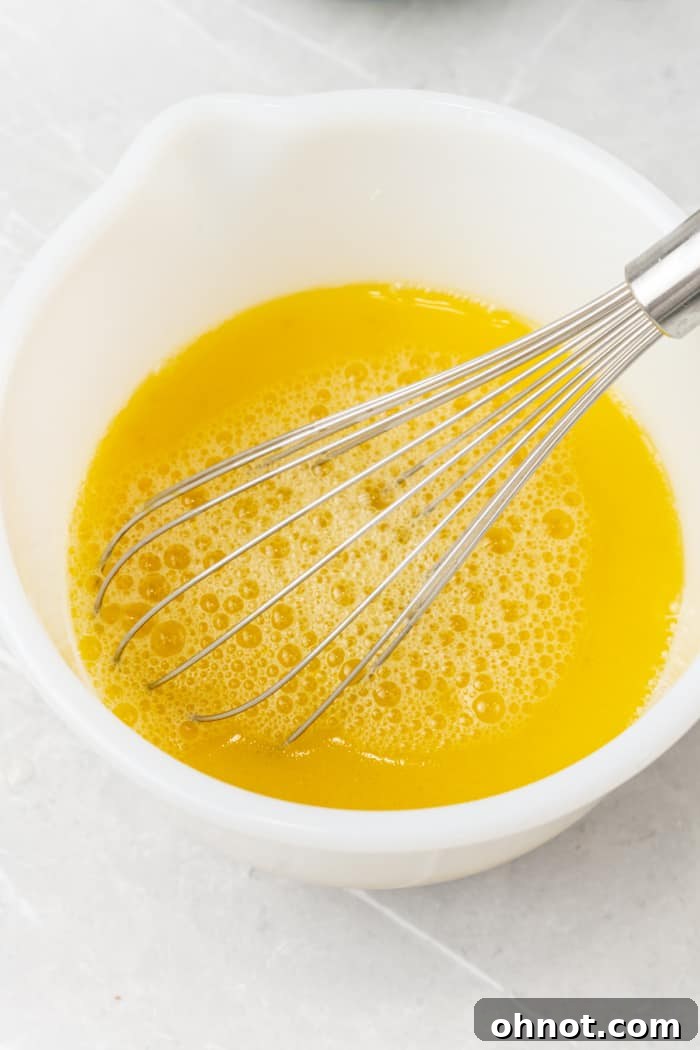 Whisked wet ingredients in a bowl.