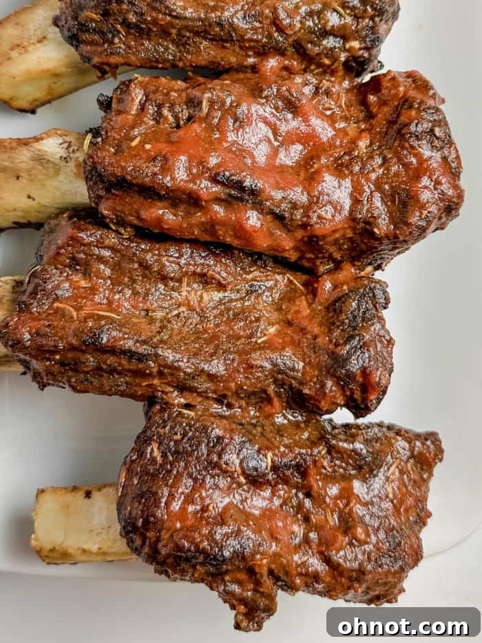 Perfectly cooked beef back ribs, glistening and ready to be served.