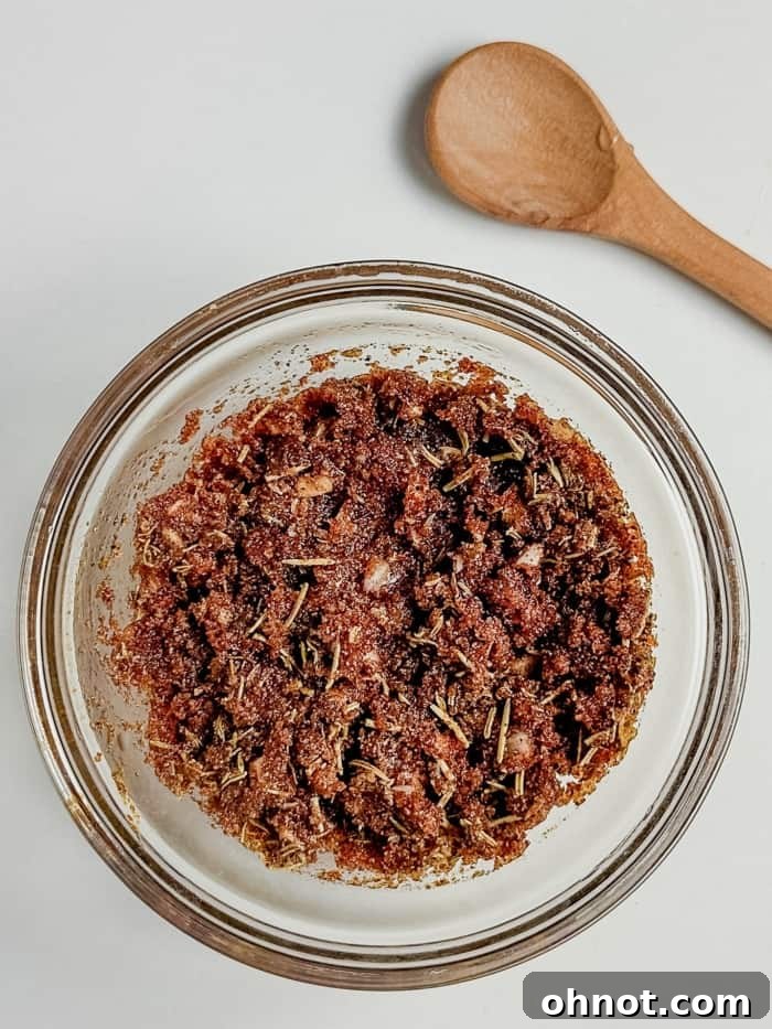 A bowl filled with a mixed dry rub, ready to be applied to beef ribs.