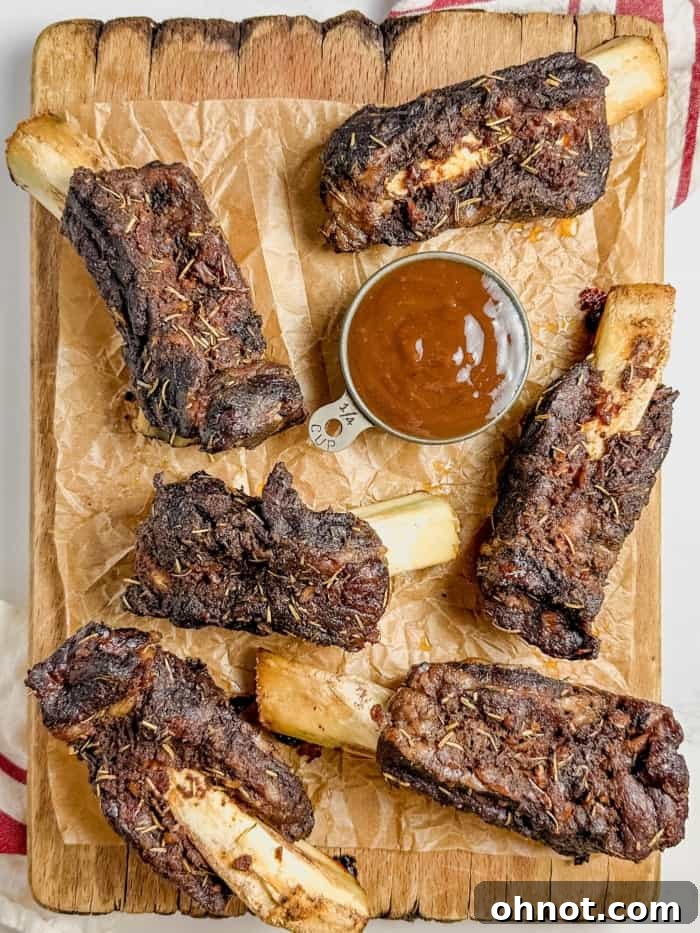Cooked beef ribs, exceptionally tender and pulling away from the bone.