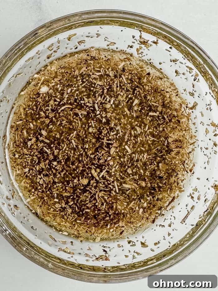 Spices and fresh ingredients for the marinade in a bowl.