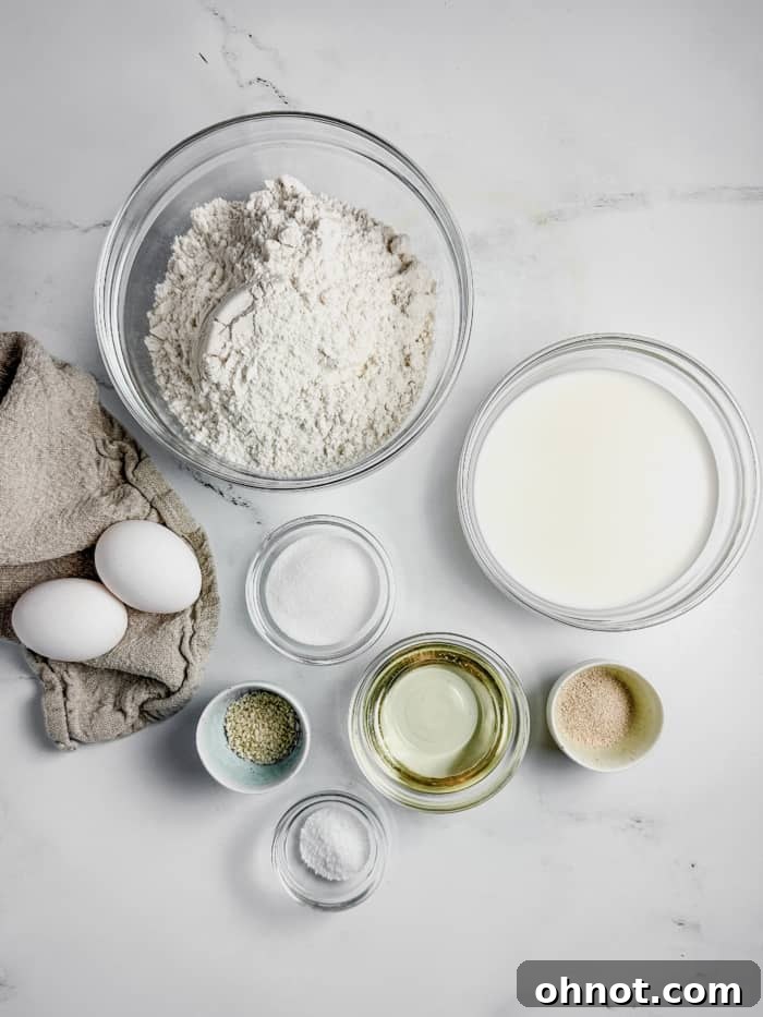 A selection of ingredients for gluten-free hamburger buns laid out on a kitchen counter.