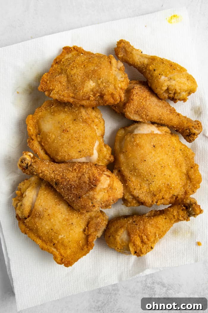 A plate of freshly fried gluten-free chicken with a perfect golden-brown breading.