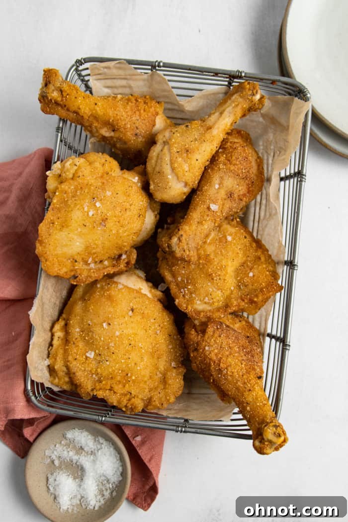 A basket full of golden, crispy gluten-free fried chicken pieces.