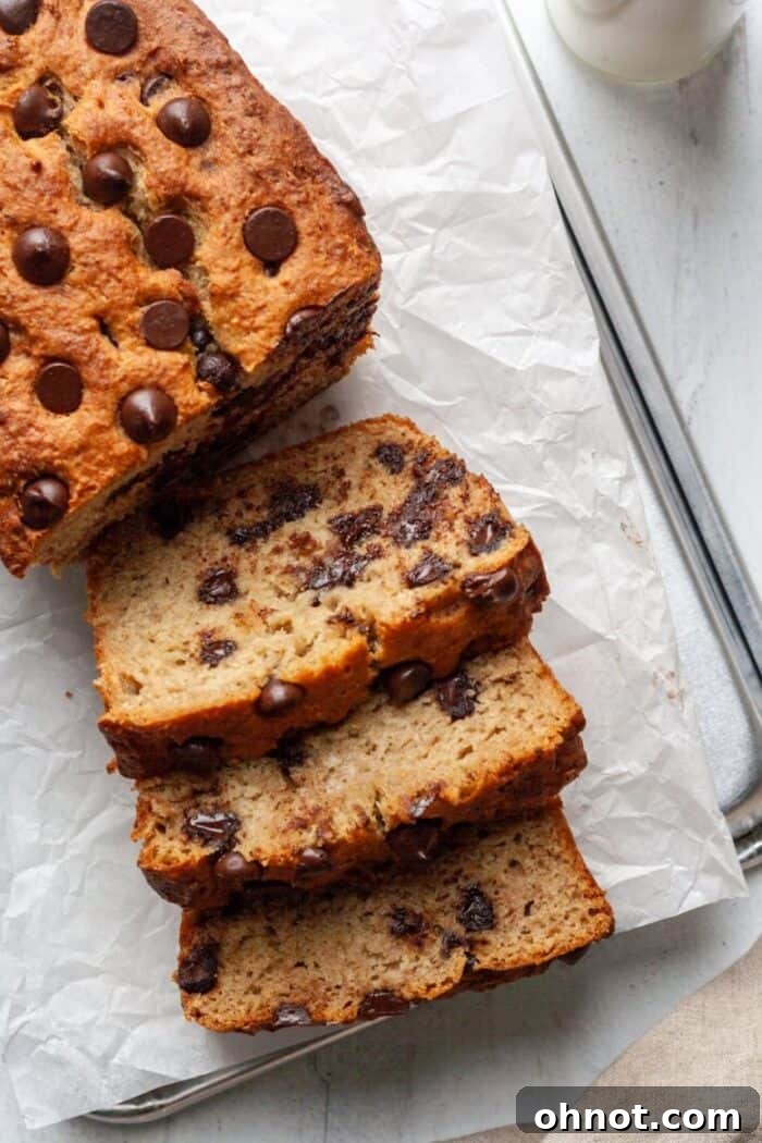 Paleo chocolate chip banana bread loaf, sliced to reveal moist interior