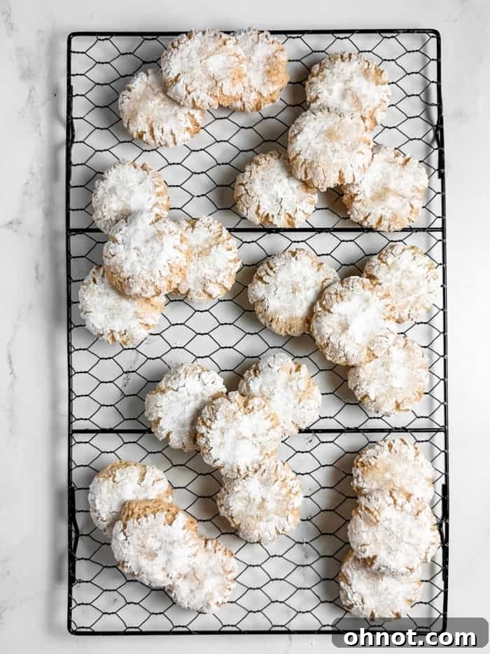Freshly baked amaretti cookies cooling on a wire rack.