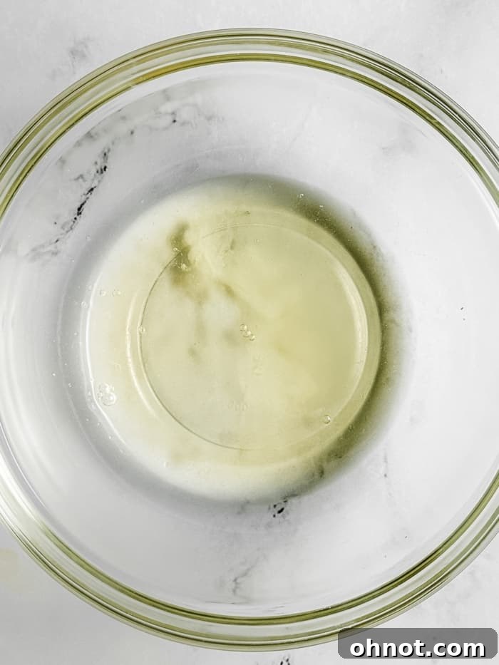 Egg whites in a mixing bowl before whipping.