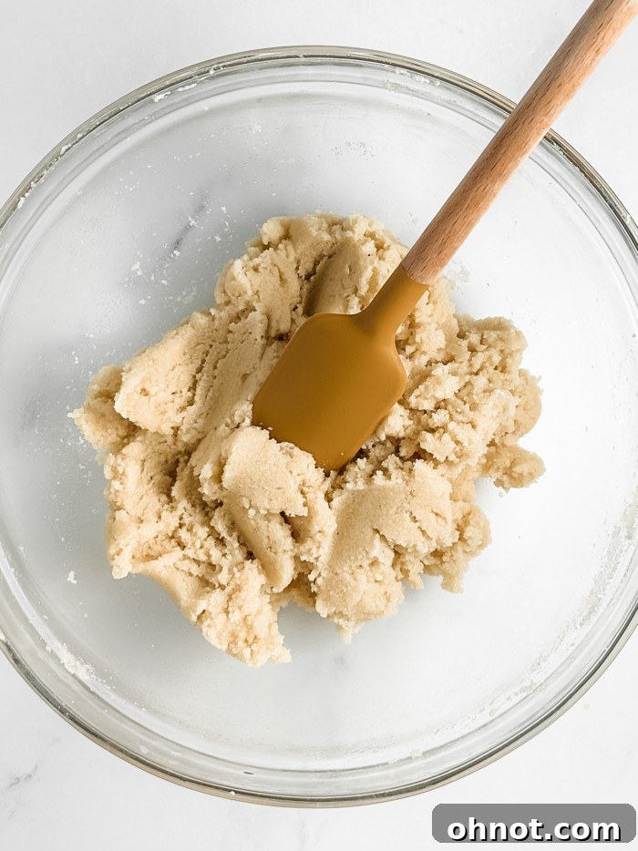 Soft, sticky amaretti cookie dough in a mixing bowl.