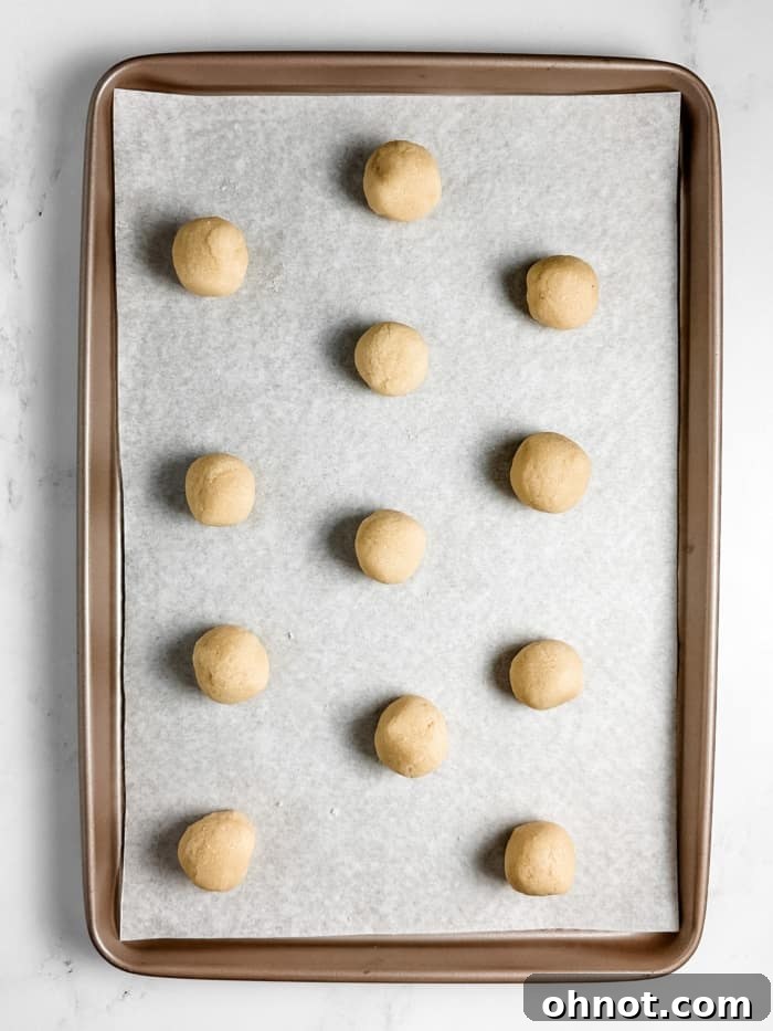 Uniform 1-inch dough balls ready for coating.
