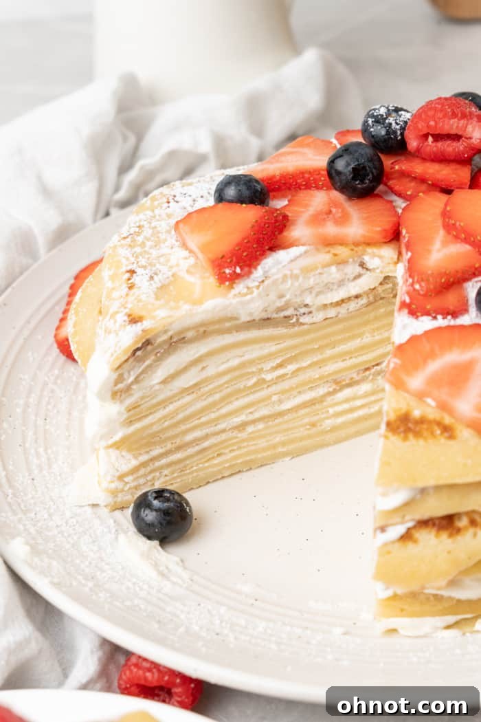 A close-up view of a crepe cake showcasing its many delicate layers of thin pancakes and creamy filling.