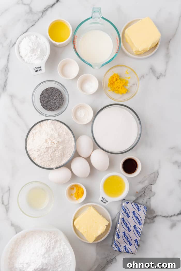 Various fresh ingredients for lemon poppy seed cake, including lemons, eggs, flour, and butter.