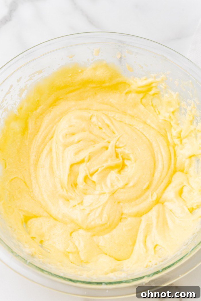 Fully beaten eggs incorporated into the butter and sugar mixture.