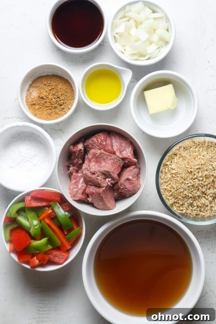 Ingredients for beef tips and rice laid out on a table.