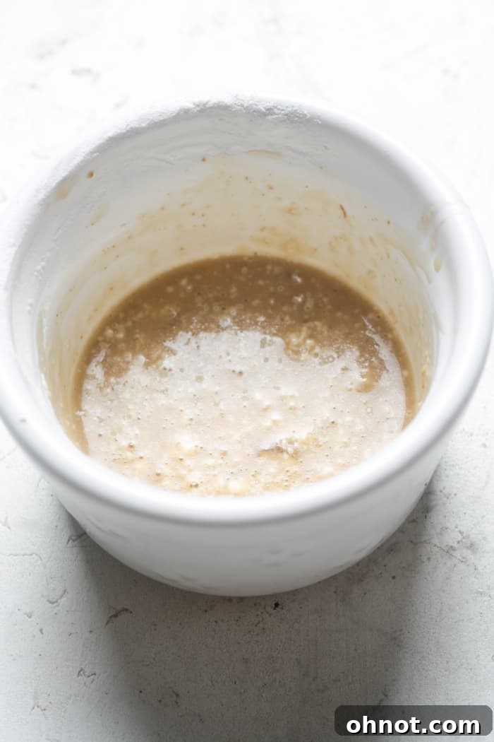 Slurry being prepared in a bowl to thicken gravy.