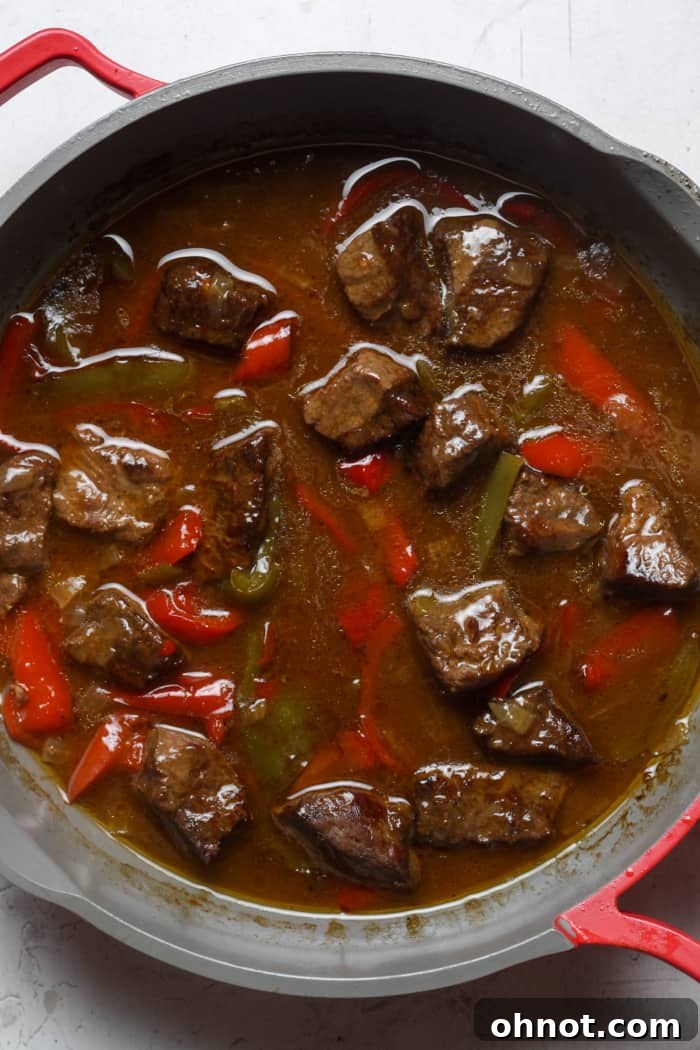 Braised meat with veggies and thickened gravy.