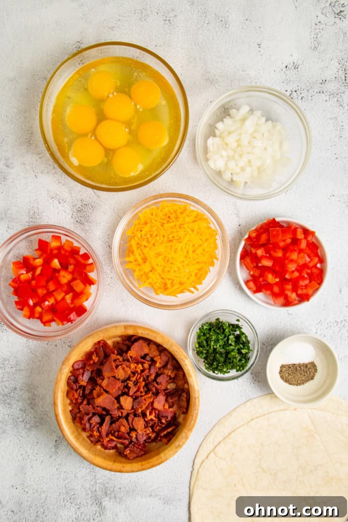 A selection of fresh ingredients laid out for healthy breakfast burritos.