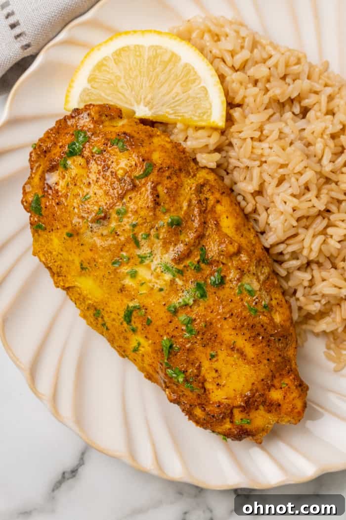 Tandoori chicken, perfectly charred and garnished with fresh cilantro, ready to be served.