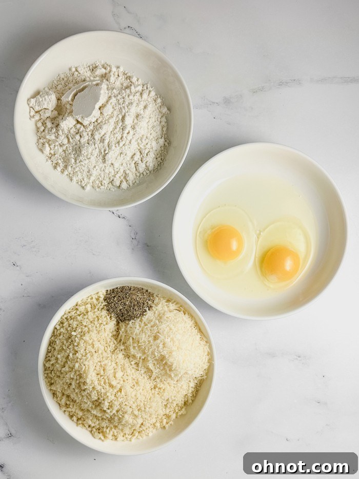 Eggs and seasonings in bowls.
