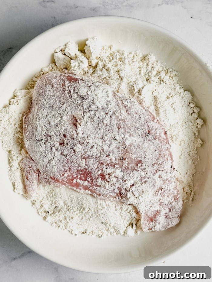 Chicken dredged in flour.