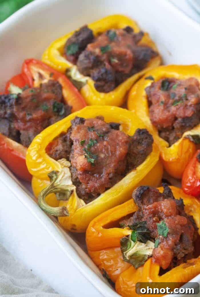 Whole30 taco stuffed peppers in white casserole dish