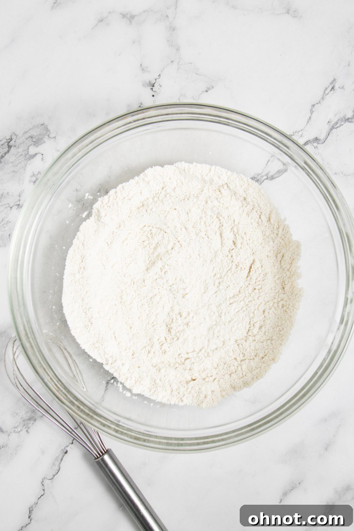 Gluten-free flour blend in a glass mixing bowl.