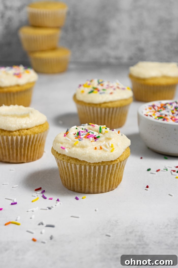 Beautifully frosted dairy-free cupcakes on a display stand, ready for celebration.