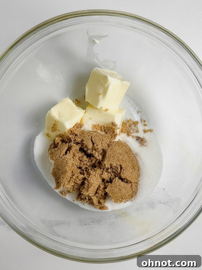Creamed butter and sugars in a mixing bowl.