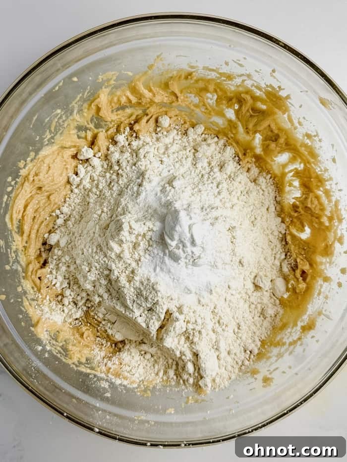Dry ingredients being incorporated into the cookie dough.