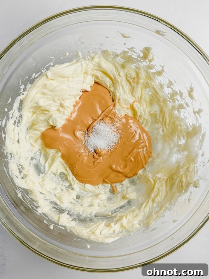 Butterscotch frosting mixture in a stand mixer.