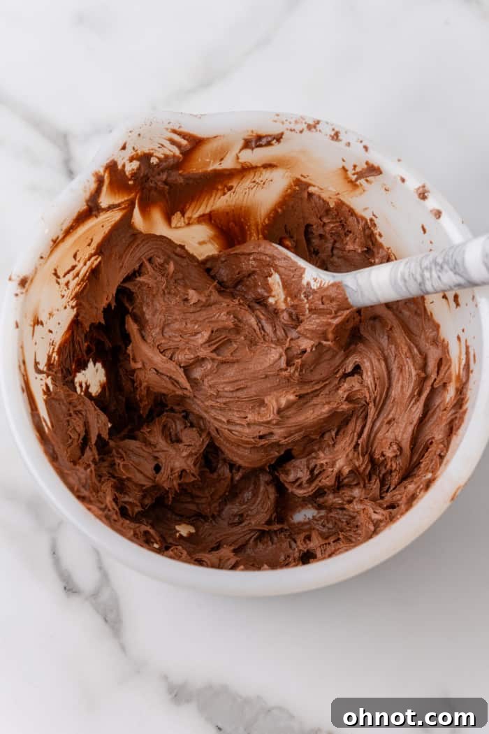 Chocolate frosting in bowl.