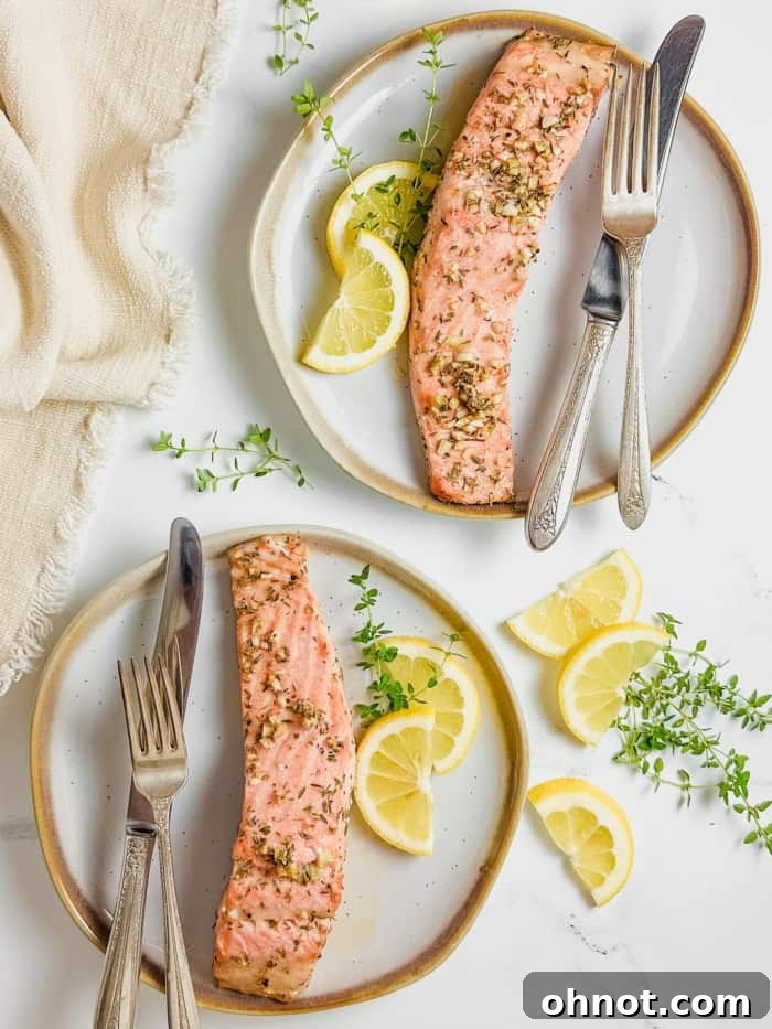 Plates with perfectly cooked orange-hued fish, ready for serving.