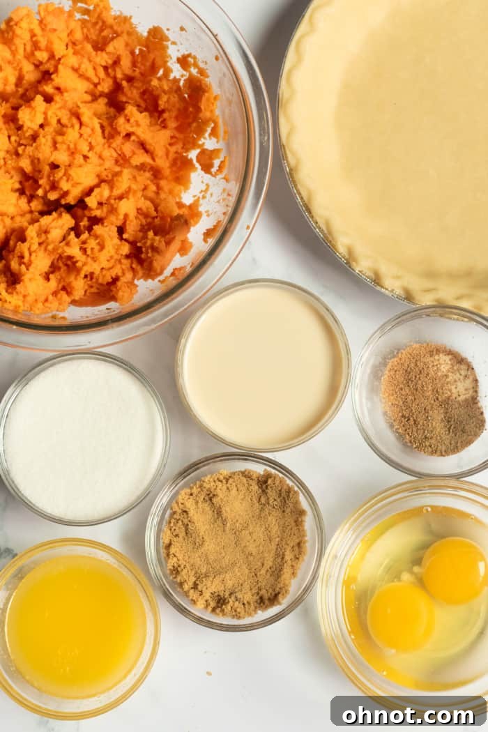 Various ingredients for sweet potato pie laid out on a kitchen counter: sweet potatoes, brown sugar, eggs, butter, and spices.
