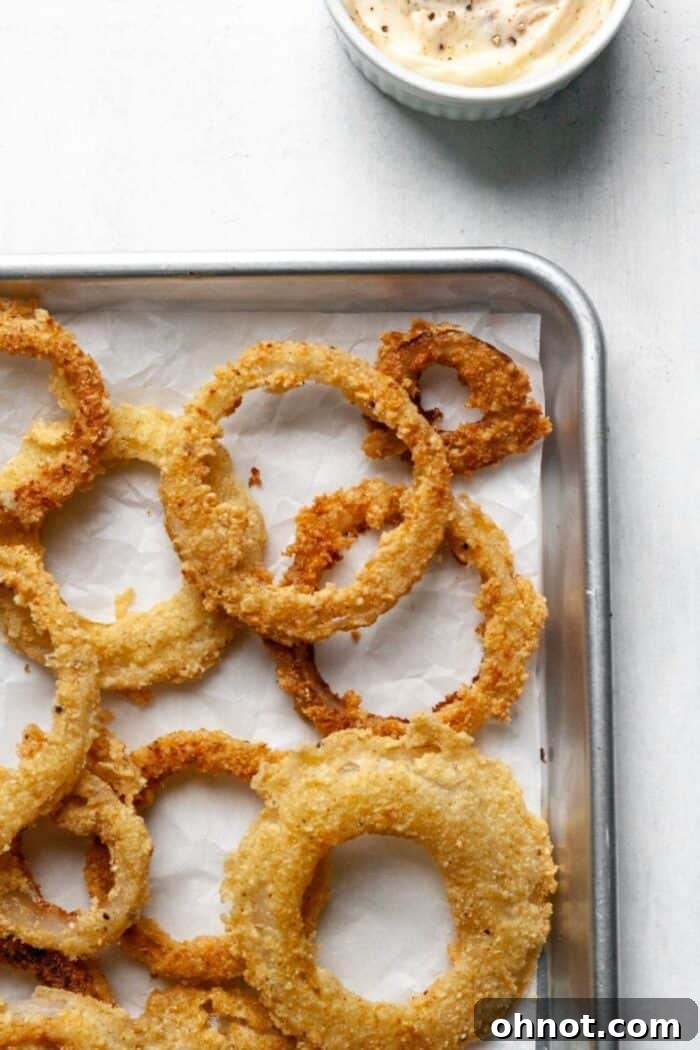 A baking sheet with onion rings.