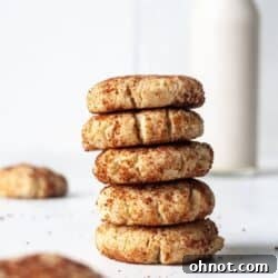 Dairy free snickerdoodles cookies, golden brown and coated with cinnamon sugar.